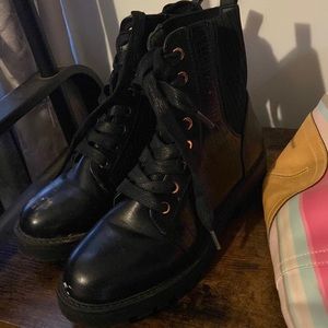 Black combat boots with snakeskin